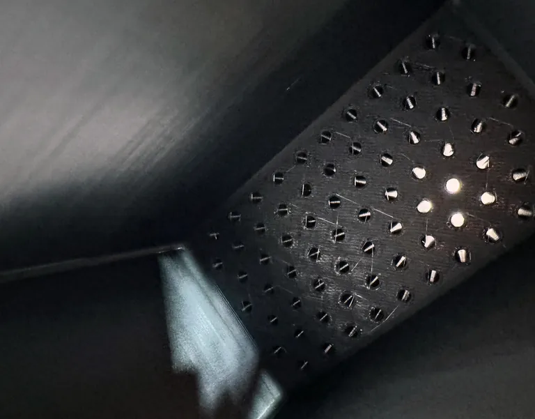 Close detail of the drilled tee slots
